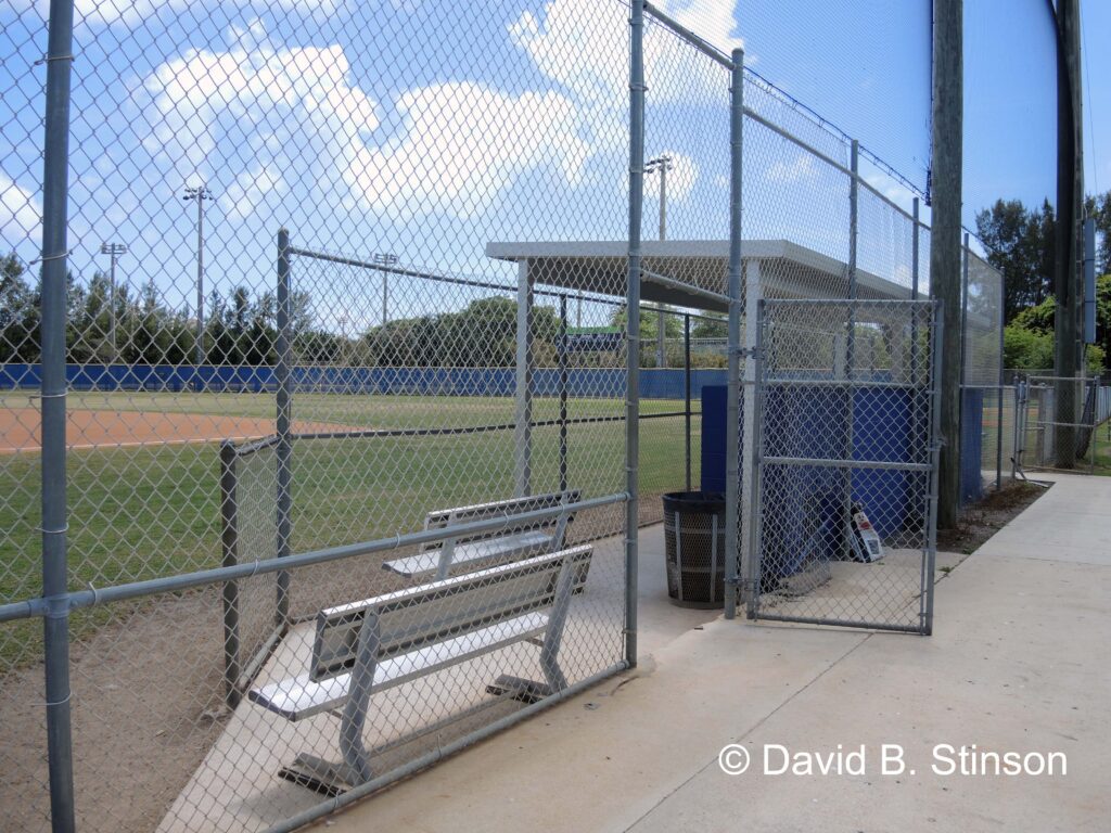 An open chainlink fence to the field