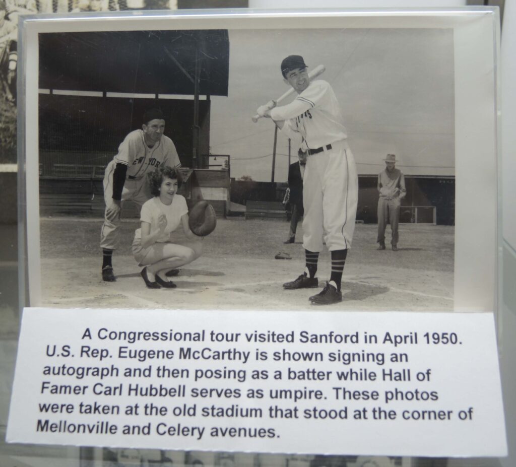 A display showing a US Rep posing as a batter