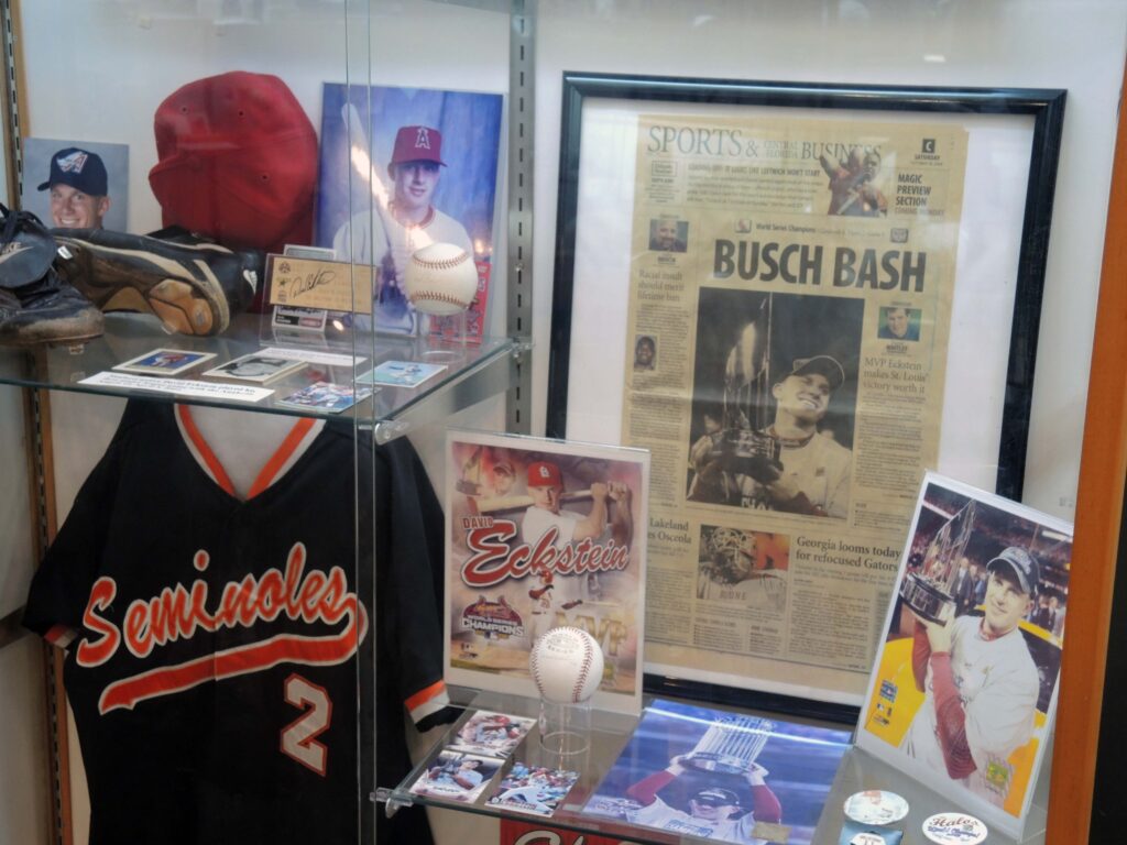 A display showing a baseball player and his items