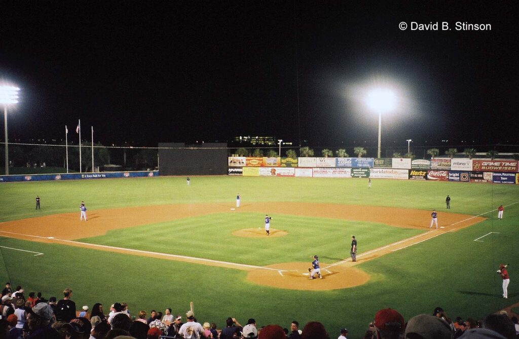 An ongoing baseball game at night