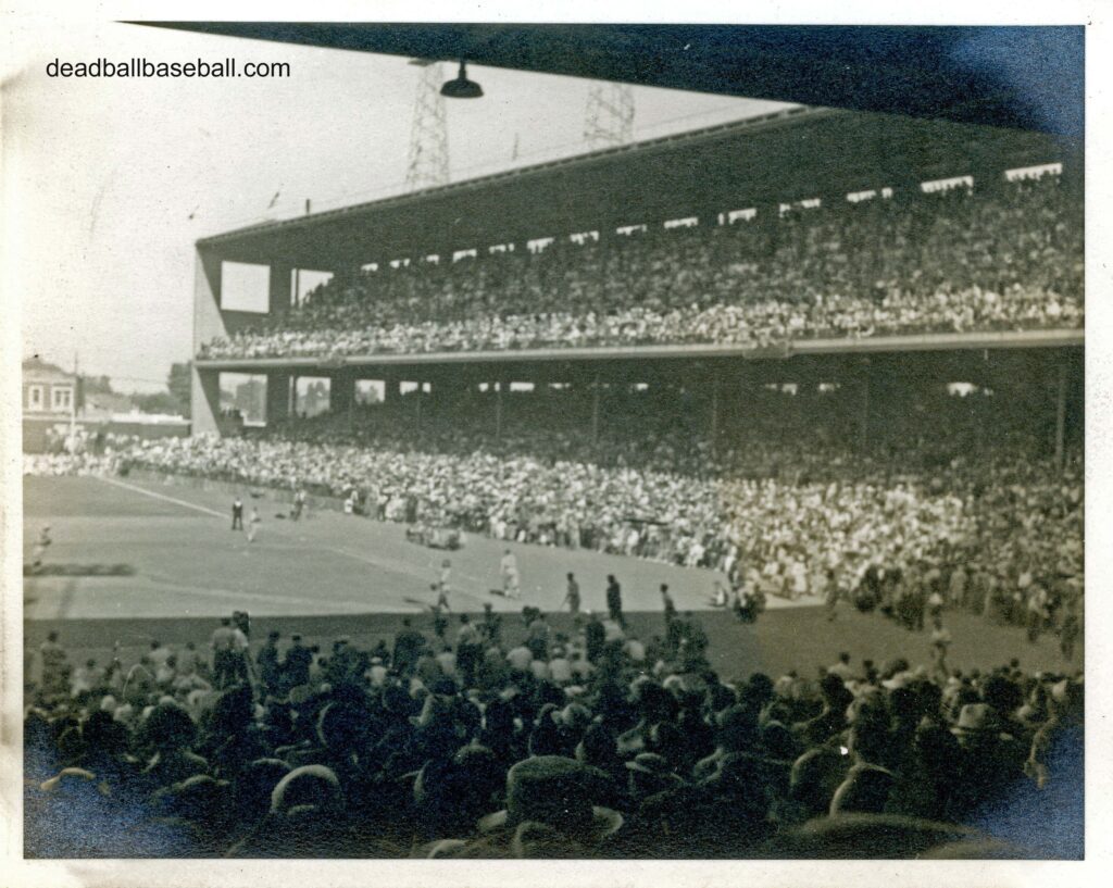 An old image of a Wrigley Field Stadium filled with people