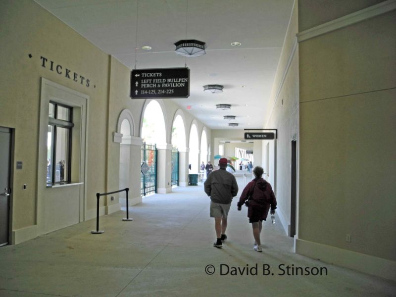 People walking along the concourse of the Ed Smith Stadium