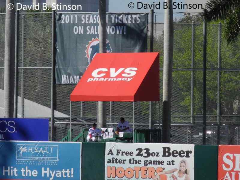 A bullpen beyond the outfield fence