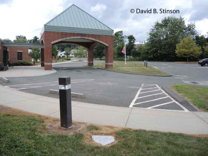 The Bulkeley Stadium home plate marker beside a parking space