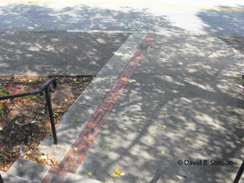 A line of bricks across a narrow street