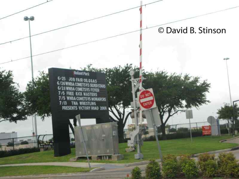 A Reliant Park sign and gate